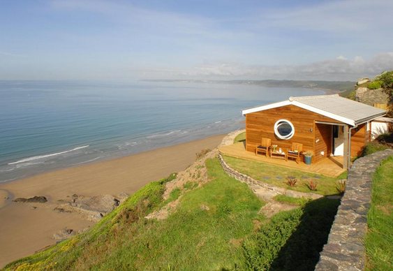 Casa em penhasco de praia Casa na beira da praia