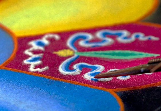 Arte com grãos de areia colorida