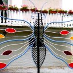 Portões de ferro franceses modelados como borboletas