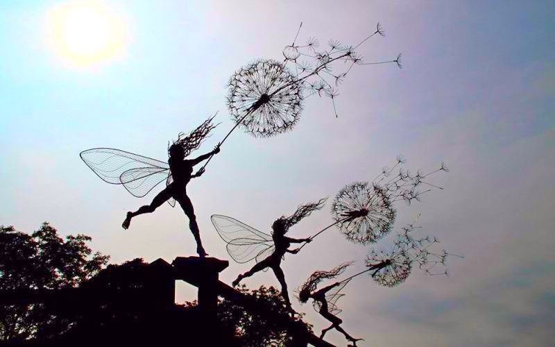 Fairies dancing with dandelions
